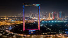 experience by boarding an elevator which takes you directly to the topmost floor or the upper horizontal rib of Dubai Frame. From its glass walkway, you can look around to revel in the city’s compelling contrast. While one side gives you the outstanding views of modern Dubai, the other side will journey you back in time, thanks to the understated yet charming structures that dot Karama, Bur Dubai, Deira, and Umm Hurair areas. There is also a café here to enrich your experience.
